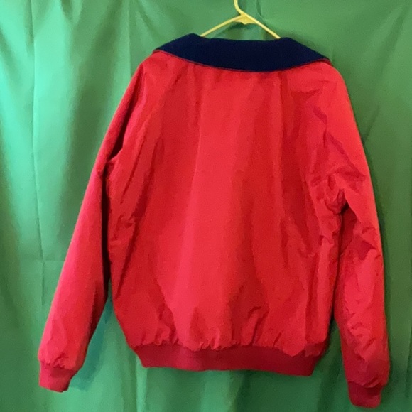 Bright red windbreaker with navy blue fleece lining and insulated sleeves. - Picture 11 of 11